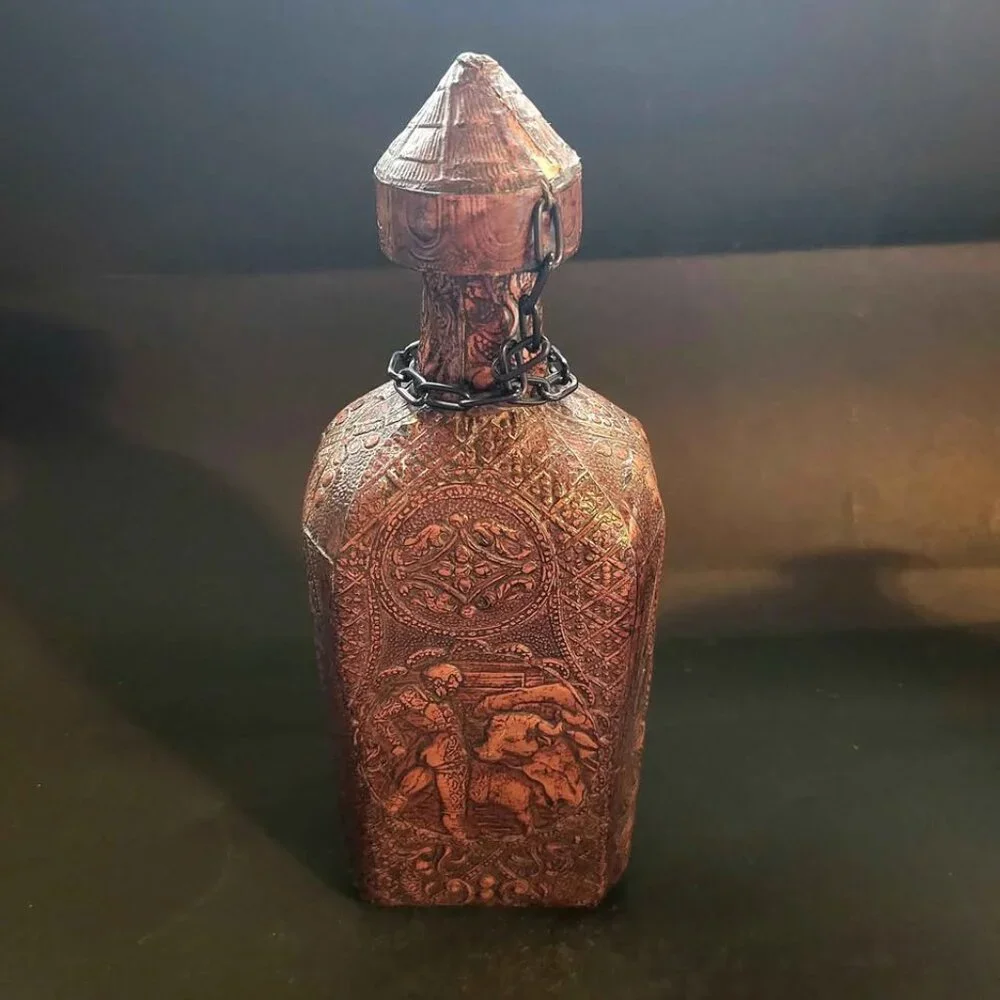 Vintage, Embossed Leather-Wrap Decanter With A Portrait Of Miguel de Cervantes